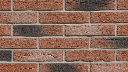 Nahaufnahme einer Ziegelwand in verschiedenen Rottönen, die eine robuste und natürliche Textur für Bau- oder Dekorprojekte bietet.