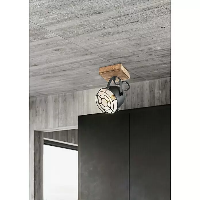 Tween Light Pecco Wandstrahler - 40 W, L x B x H: 11,5 x 11,5 x 20 cm, Schwarz, Braun, E14 - Schwarzer Metalldeckenstrahler mit sichtbarer Glühbirne und Schutzgitter, auf Holzsockel an Betondecke montiert.