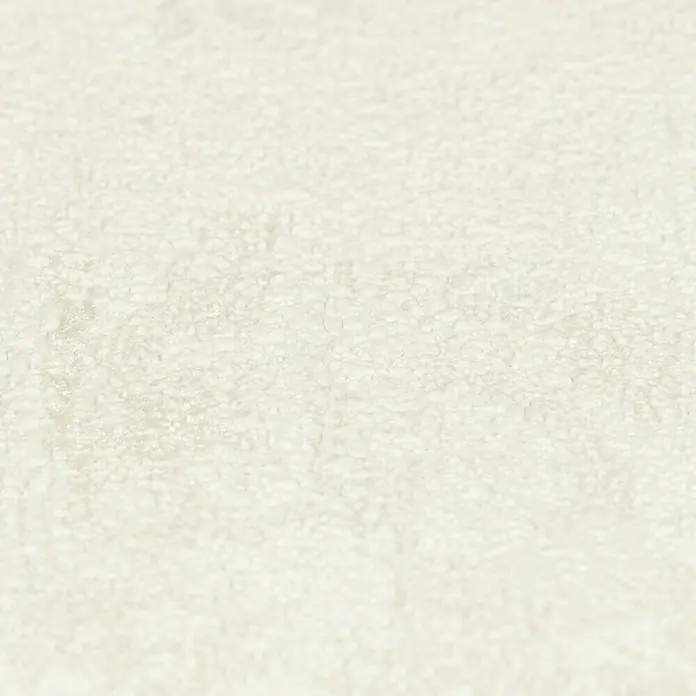 Rasch Vliestapete - Beige, Uni, 10,05 x 0,53 m, Spachtelstruktur - Detailaufnahme einer weißen, strukturierten Oberfläche, ideal für Hintergründe oder Texturen in Designprojekten, die eine sanfte Eleganz suchen.