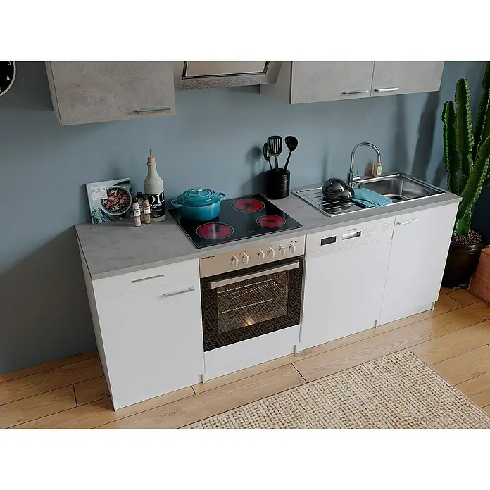 Respekta Singleküche Malia - Breite: 220 cm, Weiß/Grau, Dekor Arbeitsplatte: Betonoptik - Küchenzeile mit Spüle, Kochfeld und Backofen in einer modernen Küchenumgebung mit weißen Schränken und grauen Arbeitsplatten.