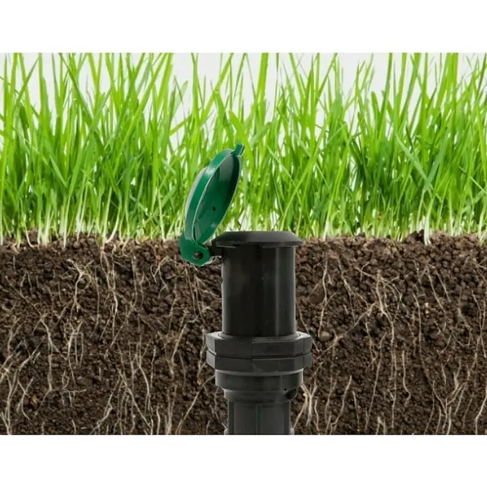 Wassersteckdose - 1″ - Bewässerungssystem für den Garten mit grünem Deckel im Rasen. Optimieren Sie Ihre Rasenpflege mit diesem versenkbaren Rasensprenger.