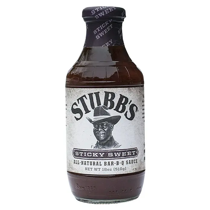 Stubb's Barbecuesauce Sticky Sweet - 450 ml - Ein Flasche Stubb's Sticky Sweet BBQ-Sauce. Die Etikettierung zeigt ein Porträt von Herrn Stubb, dem Gründer.