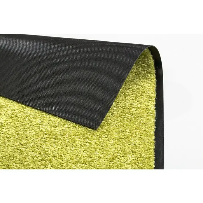 Astra Schmutzfangmatte Proper Tex - Grün, 40 x 60 cm, Material Nutzschicht: 100 % Polyamid - Nahaufnahme eines Teppichs mit grüner Oberfläche und schwarzer Unterseite, der aufgerollt ist, um die Textur zu zeigen.