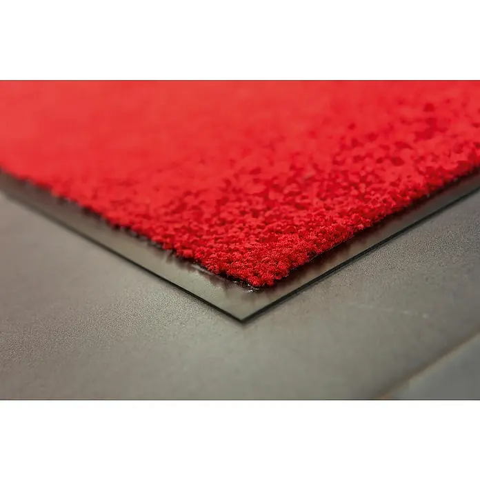 Astra Schmutzfangmatte Proper Tex - Rot, 60 x 180 cm, Material Nutzschicht: 100 % Polyamid - Nahaufnahme einer roten Fußmatte mit schwarzem Rand, ideal für den Innenbereich und zur Schmutzabweisung.