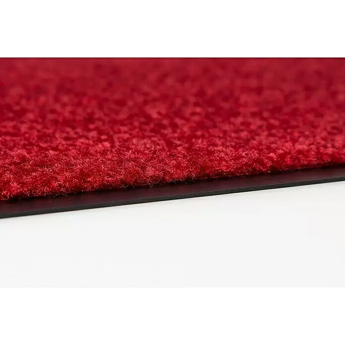 Astra Schmutzfangmatte Proper Tex - Rot, 60 x 180 cm, Material Nutzschicht: 100 % Polyamid - Nahaufnahme einer roten strukturierten Matte mit schwarzem Rand.