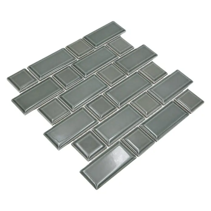 Mosaikfliese Metro Uni CG M06PM - 29,4 x 29,1 cm, Petrol, Glänzend - Nahaufnahme von grauen Subway-Fliesen mit glänzender Oberfläche und abgeschrägten Kanten, die ein elegantes Muster bilden.