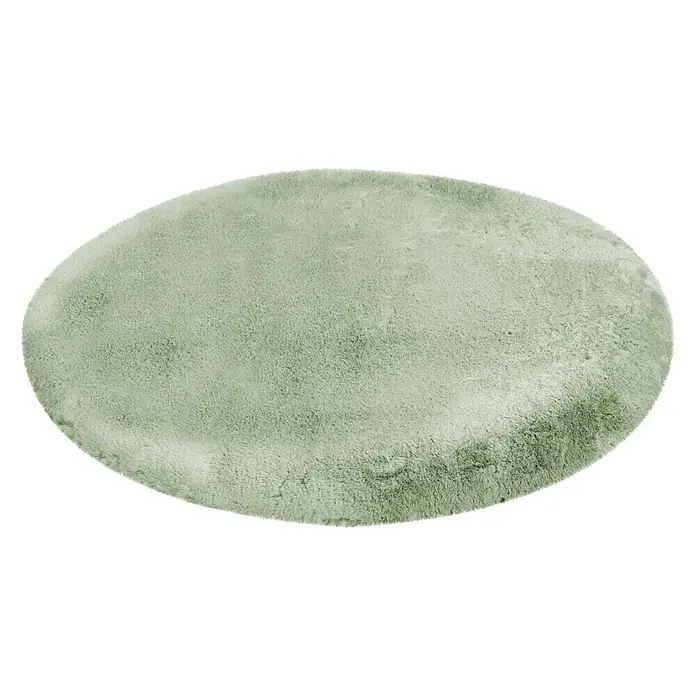 Fellteppich Happy - Jade, Durchmesser: 160 cm, 100 % Polyester (Flor) - Ein runder, hellgrüner Teppich mit flauschiger Textur auf schwarzem Hintergrund. Der Teppich wirkt weich und einladend.