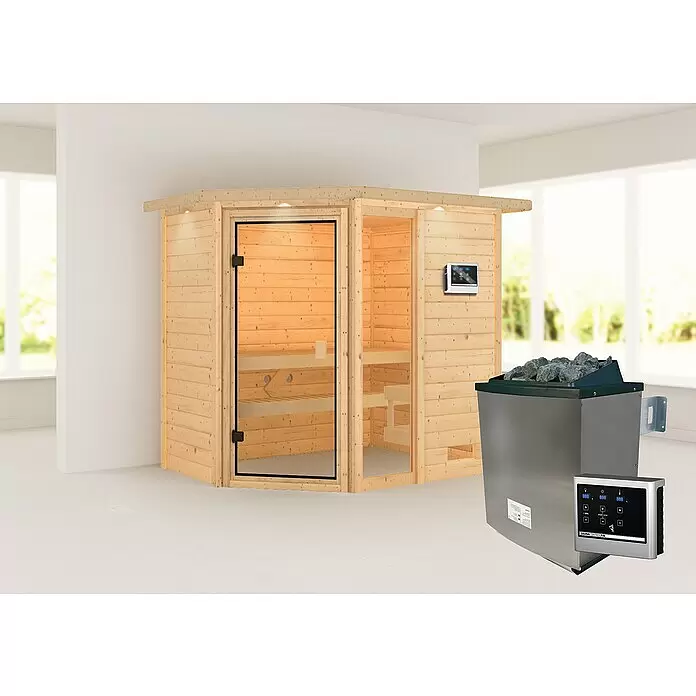 Karibu Massivholzsauna Jada - L x B x H: 160 x 224 x 191 cm, Mit 9 kW Ofen mit externer Steuerung, Mit Dachkranz und Beleuchtung - Hölzerne Saunakabine mit Glastür und metallischer Saunaofen mit Bedienfeld in einem hellen Innenraum.