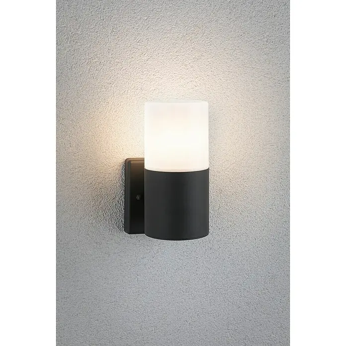 Paulmann Außenwandleuchte Tubs - 15 W, Grau matt, E27, IP44, Ohne Bewegungsmelder - Diese Aufnahme zeigt eine stilvolle, zylindrische Wandleuchte mit einem schwarzen Sockel und einem opalen Glasdiffusor.