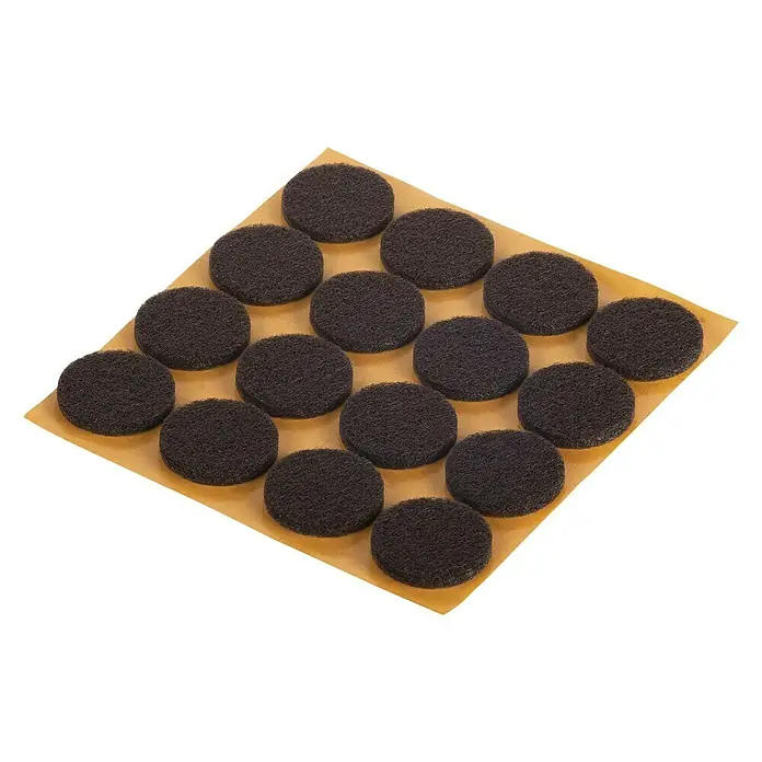 Fix-o-moll Filzgleiter - Durchmesser: 22 mm, Kleben, 16 Stk., Braun - Nahaufnahme von braunen Möbelgleitern auf einem Blatt, die ideal zum Schutz von Böden vor Kratzern sind.