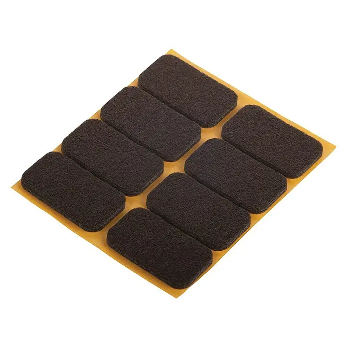 Suki Patín antideslizante para alfombras - Diámetro: 22 mm, Marrón, Pegado, An x Al: 22 x 36 mm, 8 ud. - Esta foto muestra almohadillas para muebles adheridas a un soporte amarillo. Las almohadillas protegen los pisos de rayones y facilitan la movilidad.