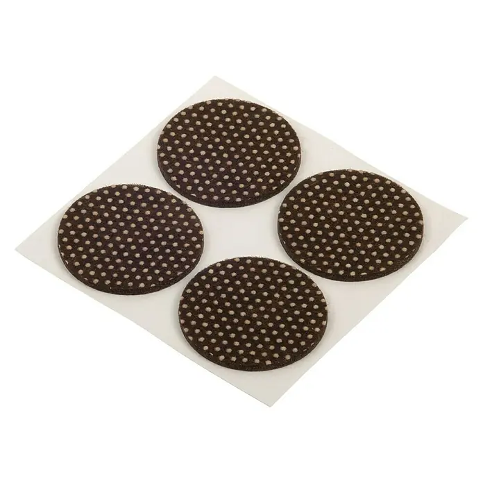 Fix-o-moll Patín antideslizante para alfombras - Diámetro: 40 mm, Redonda, Marrón, 4 ud. - Cuatro deslizadores redondos para muebles con patrones de puntos sobre una superficie blanca, ideales para proteger los pisos.