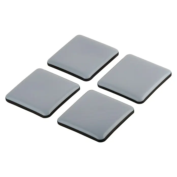 Suki Protector para muebles - An x L: 50 x 50 mm, Gris - Cuatro deslizadores cuadrados grises para muebles sobre un fondo negro. Ideal para proteger suelos y muebles.
