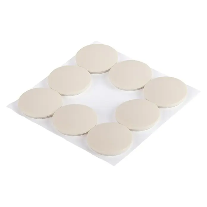 Fix-o-moll Teppichgleiter - Durchmesser: 30 mm - Eine quadratische weiße Platte mit kreisförmigen Idlis. Die Idlis sind in einer Kreisform angeordnet.