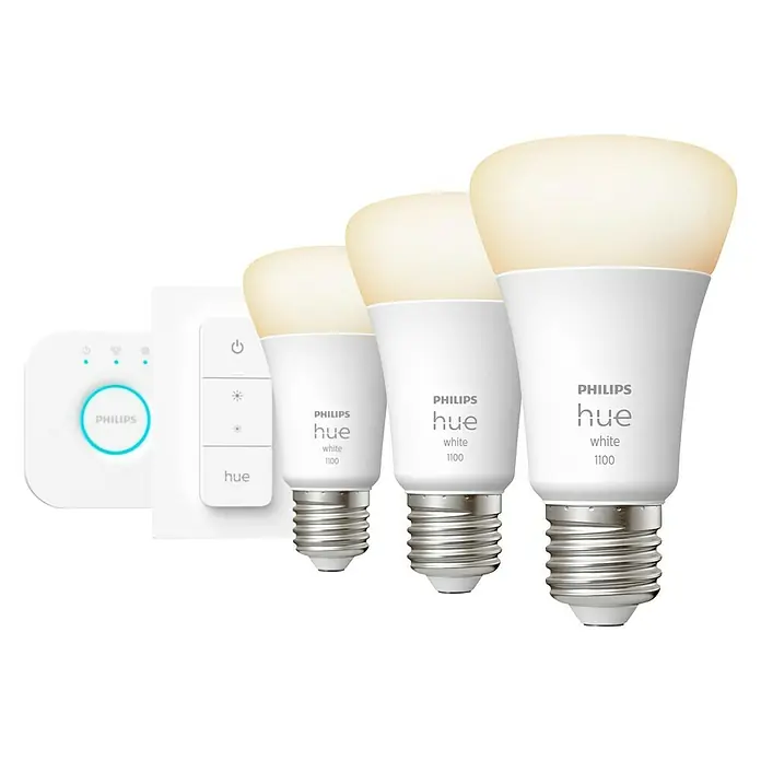 Philips Hue LED-Lampe WhiteE27, Dimmbar, Warmweiß, 1.055 lm, 9,5 W - Nahaufnahme eines Philips Hue White 1100 Starter Kits mit drei Glühbirnen, einer Bridge und einem Dimmschalter.