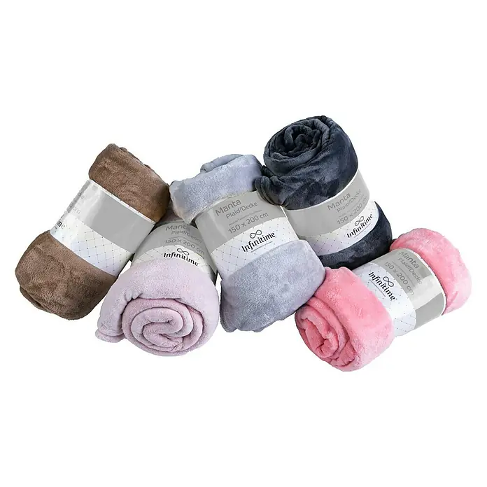 Manta para sofá Sweets -  - Una selección de mantas polares Infinitime acogedoras en varios colores, enrolladas y fajadas.
