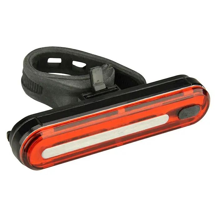 Fischer LED-Rückleuchte - Leuchtdauer: 4,5 h, Lebensdauer: 50.000 h, 3 -tlg. - Nahaufnahme einer Fahrradrückleuchte mit einer roten Linse und einem schwarzen Gummiband zur Befestigung am Fahrrad.