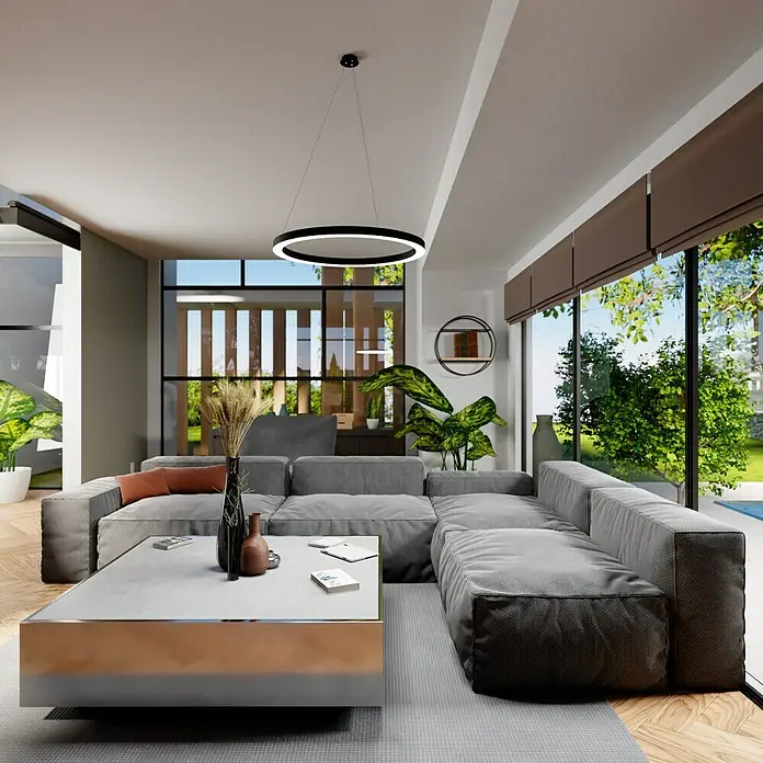 Direct Signs LED-Pendelleuchte Noble - Durchmesser: 800 mm, Schwarz - Das Bild zeigt ein modernes Wohnzimmer mit einem grauen Ecksofa, einem Couchtisch und einer kreisförmigen Hängelampe. Große Fenster bieten einen Blick ins Grüne.