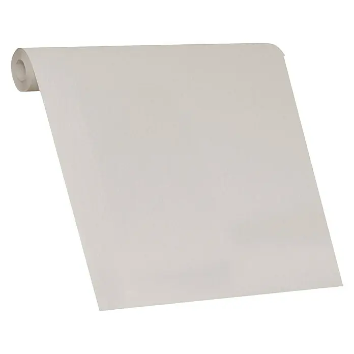 SCHÖNER WOHNEN-Kollektion Vliestapete Unistruktur - Hellbeige, Uni, 10,05 x 0,53 m - Eine Rolle weißes Papier, perfekt für kreative Projekte oder als neutraler Hintergrund, liegt auf einer schwarzen Oberfläche.