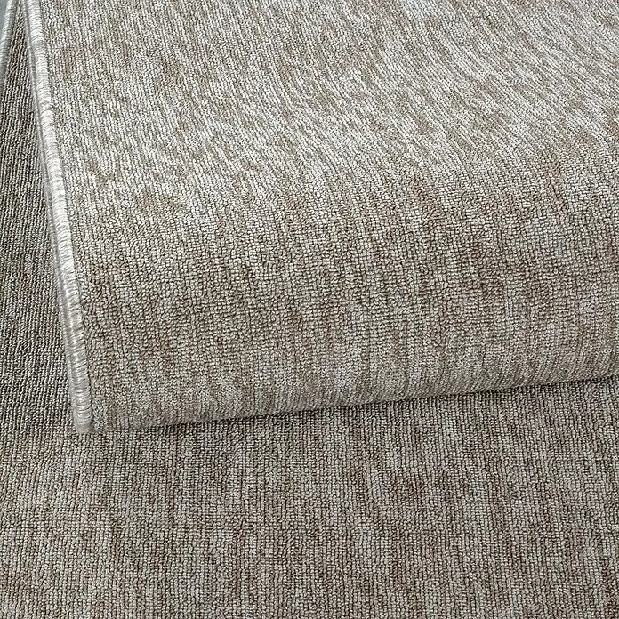 Kurzflorteppich Nizza - Beige, Durchmesser: 160 cm, 100 % Polypropylen - Hellbeiger Teppich mit strukturierter Schlingenware, teilweise aufgerollt dargestellt.