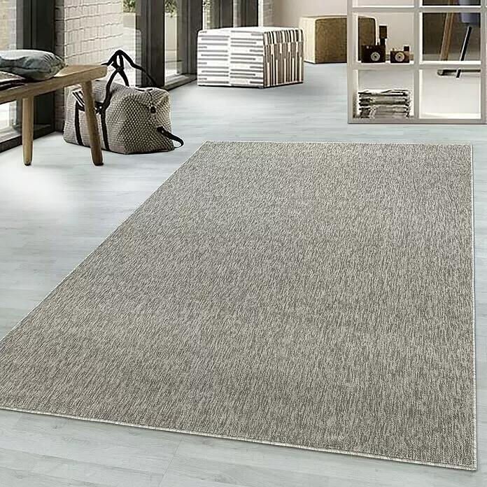 Flachgewebeteppich Nizza 1800 - Beige, 100 x 60 cm, 100% Polypropylen - Ein hellbrauner, texturierter Rechteckteppich auf hellem Holzboden in einem modernen Raum.