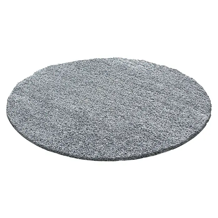 Hochflorteppich Life 1500 - Light Grey, Durchmesser: 120 cm, 100% Polypropylen - Grauer runder Teppich mit weicher Textur auf schwarzem Hintergrund.