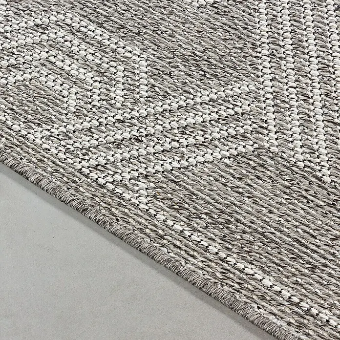 Outdoor-Teppich Aruba 4904 - Grau, 170 x 120 cm, 100% Polypropylen - Nahaufnahme eines strukturierten Teppichs mit grau-weißen Mustern, der eine angenehme Textur und ein modernes Design zeigt.
