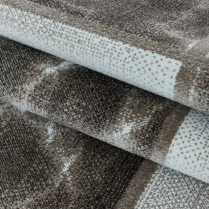 Kurzflorteppich Ottawa 4201 - Braun, 200 x 140 cm, 100% Polypropylen - Gefalteter Teppich mit strukturiertem, abstraktem braun-weißem Muster.