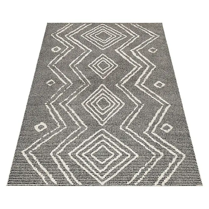 Kurzflorteppich Taznaxt 5104 - Schwarz, 200 x 140 cm, 100% Polyester - Ein rechteckiger Teppich mit einem geometrischen Muster aus weißen Rauten auf einem grauen, gestreiften Hintergrund.