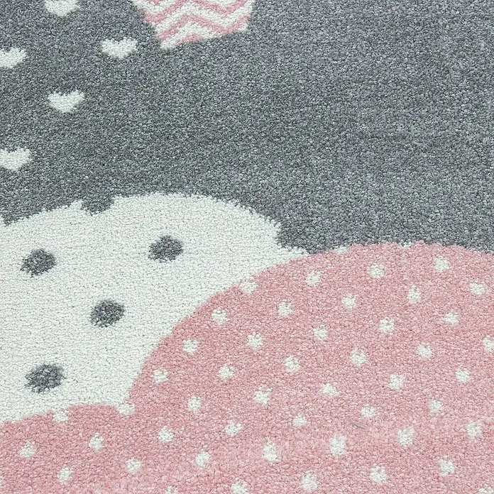 Kinderteppich Bambi 0820 - Pink, Durchmesser: 160 cm, 100 % Polypropylen - Nahaufnahme eines Teppichs mit grauem, weißem und rosa Muster. Ein dekorativer Teppich, ideal für Kinderzimmer.