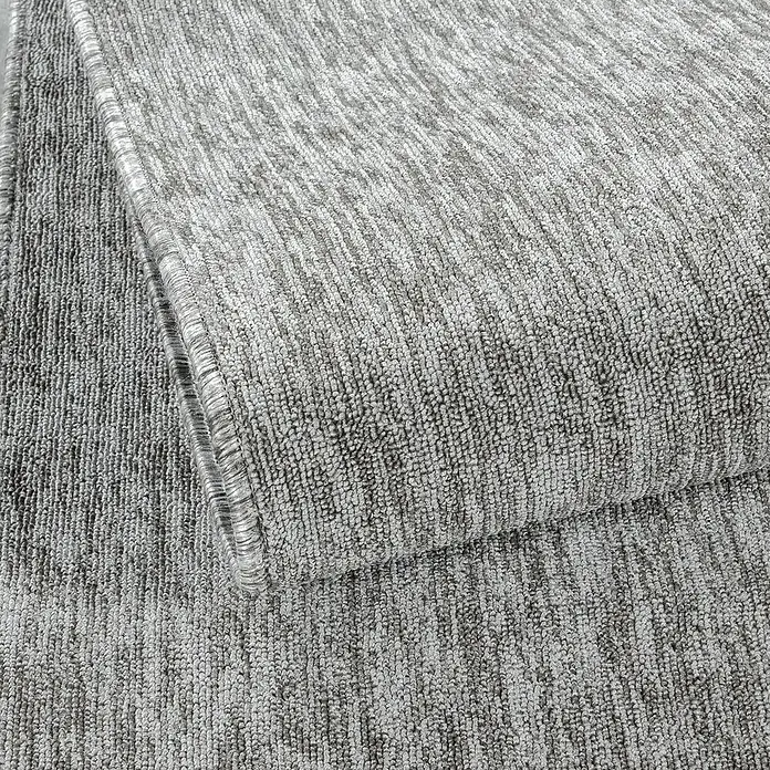 Flachgewebeteppich Nizza 1800 - Light Grey, 150 x 80 cm, 100% Polypropylen - Nahaufnahme eines grauen Teppichs, der die Textur und das Muster des Materials hervorhebt. Perfekt, um jedem Raum Wärme und Komfort zu verleihen.
