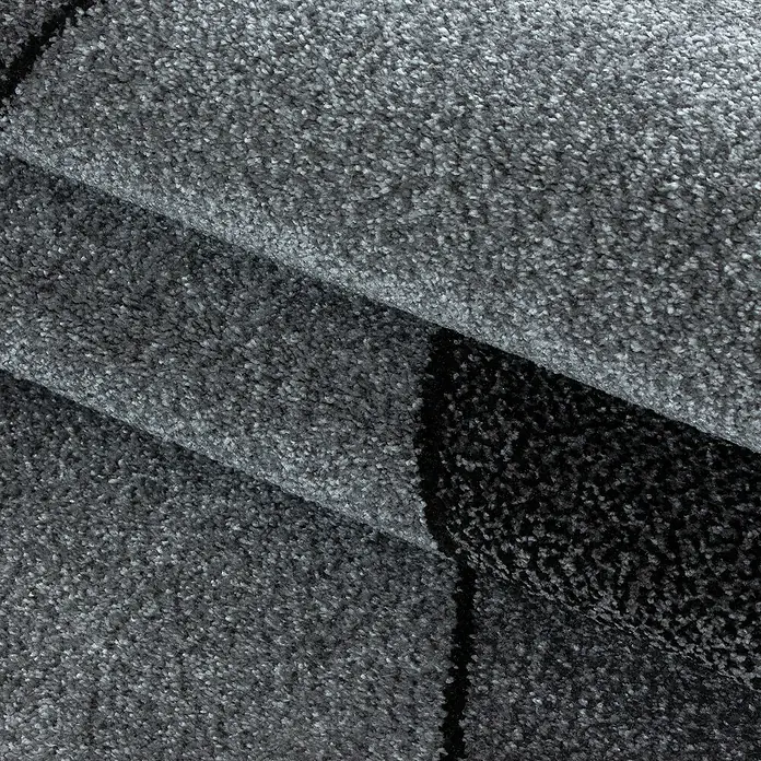 Kurzflorteppich Beta 1120Grau, 230 x 160 cm, 100 % Polypropylen - Nahaufnahme von grauem Teppich mit Textur.