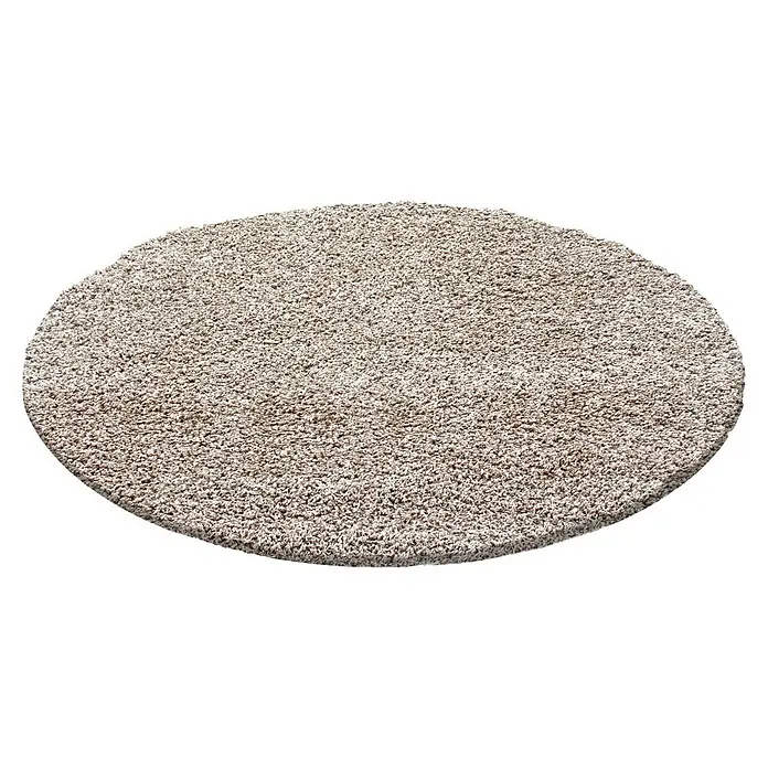 Hochflorteppich Life 1500Beige, Durchmesser: 200 cm, 100% Polypropylen - Ein runder Teppich mit Fransen in einer hellen, neutralen Farbe, perfekt für jeden Raum im Haus.