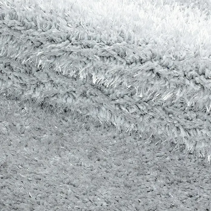 Hochflorteppich Brilliant 4200Silber, Durchmesser: 200 cm, 100% Polyester - Nahaufnahme eines luxuriösen, weißen Zottelteppichs, der Weichheit und Komfort ausstrahlt. Ideal für gemütliche Wohnräume.