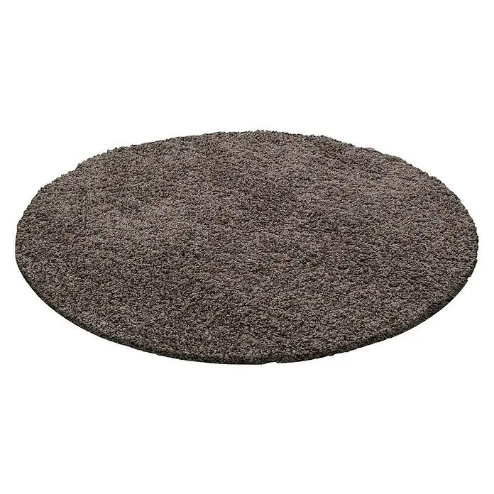 Hochflorteppich Dream 4000Taupe, Durchmesser: 80 cm, 100% Polypropylen - Nahaufnahme eines runden, grau-braunen Shaggy-Teppichs. Der Teppich hat eine weiche Textur und ist ideal für jeden Raum.