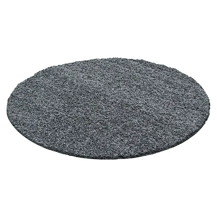 Hochflorteppich Dream 4000Grau, Durchmesser: 80 cm, 100 % Polypropylen - Grauer, runder Teppich mit weicher Textur vor schwarzem Hintergrund. Ideal für Wohnräume, sorgt für Wärme und Komfort.