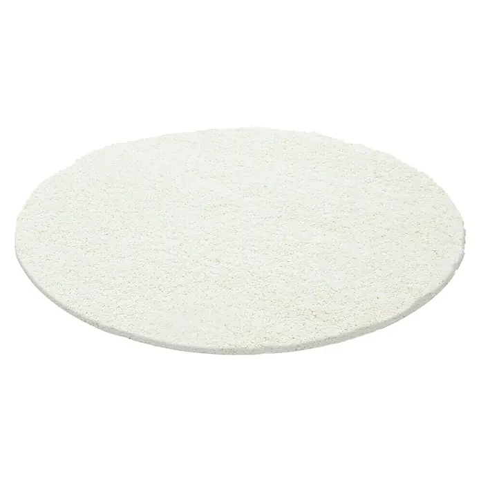 Hochflorteppich Life 1500 - Cream, Durchmesser: 80 cm, 100 % Polypropylen - Ein weißer, runder Teppich auf schwarzem Hintergrund, ideal für Wohnräume und verleiht jedem Zimmer eine gemütliche Atmosphäre.