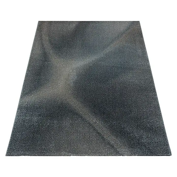 Kurzflorteppich Efor 3714Braun, 200 x 140 cm, 100 % Polypropylen - Nahaufnahme eines grauen Teppichs mit subtilen Lichteffekten, ideal für moderne Wohnräume.