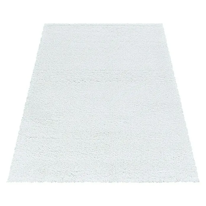 Hochflorteppich Fluffy 3500 - Weiß, 200 x 140 cm, 100 % Polypropylen - Ein detailreiches Bild eines quadratischen, strahlend weißen Hochflorteppichs, der eine weiche Textur und einladendes Aussehen vermittelt.