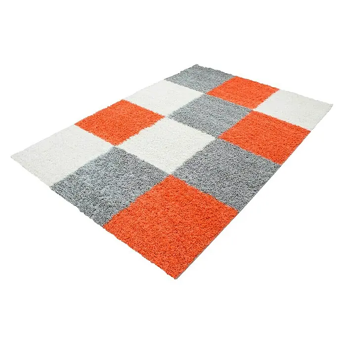 Hochflorteppich Life 1501Terra, 290 x 200 cm, 100% Polypropylen - Ein quadratischer Teppich mit einem Schachbrettmuster aus weißen, grauen und orangefarbenen Quadraten auf einem schwarzen Hintergrund.