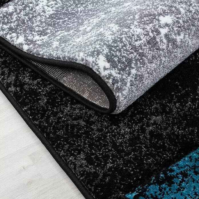Kurzflorteppich Hawaii 1330 - Türkis, 340 x 240 cm, 100 % Polypropylen - Nahaufnahme von zwei modernen gesprenkelten Teppichen, einer grau-weiß, der andere schwarz, grau und türkis, mit schwarzer Einfassung.