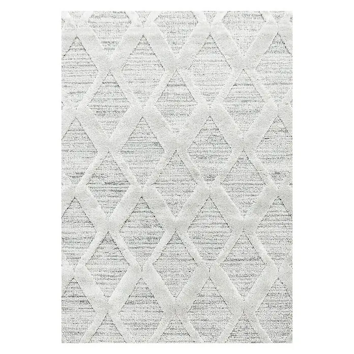 Hochflorteppich Pisa 4703 - Grau, 110 x 60 cm, 100% Polypropylen - Nahaufnahme eines weißen Teppichs mit einem geprägten Rautenmuster, der eine elegante und strukturierte Oberfläche zeigt.