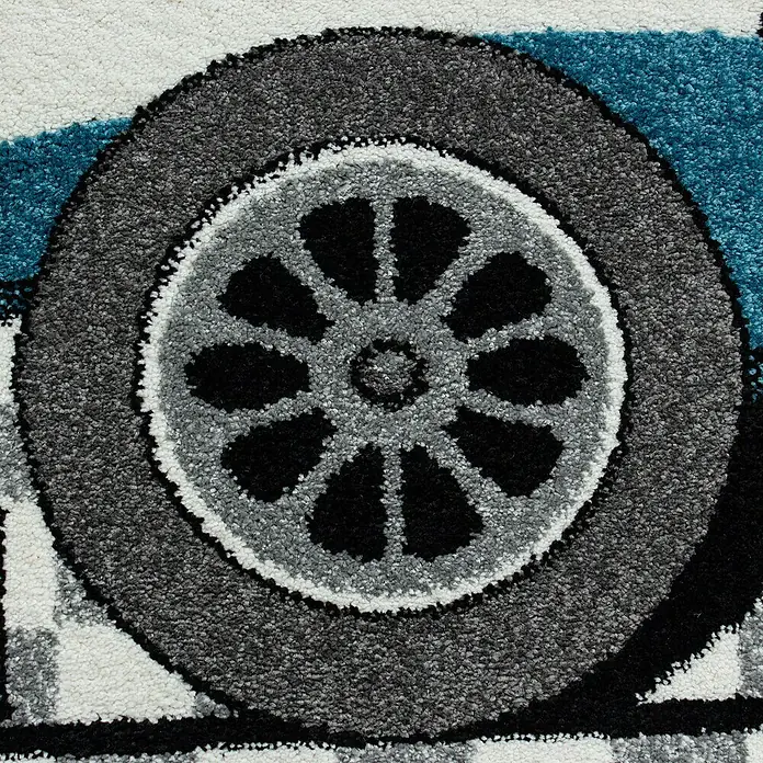 Kinderteppich Kids 0460 - Blau, 150 x 80 cm, 100% Polypropylen - Nahaufnahme eines Teppichs mit Reifendruck in Grau-, Schwarz- und Blautönen.