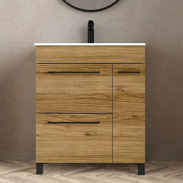 Artysan Mueble bajo de lavabo Tabarca - L x An x Al: 44,6 x 70 x 83,3 cm, Roble Guadarrama - Mueble de baño de madera clara con herrajes y patas negras. El lavabo es blanco y el grifo es negro.