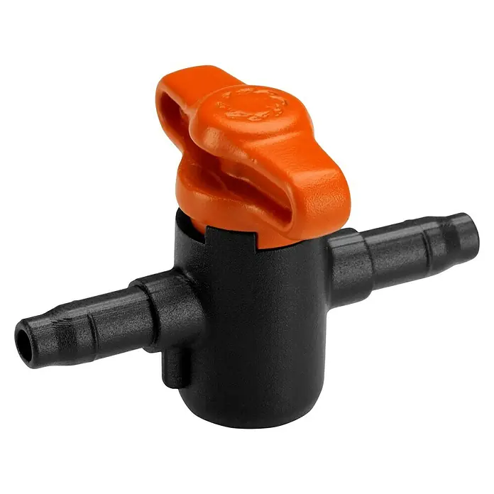 Gardena Micro-Drip Absperrventil - ³⁄₁₆″ - Ein orangefarbener Hahn auf einem schwarzen Ventil, ein unverzichtbares Zubehör für Bewässerungssysteme im Garten.