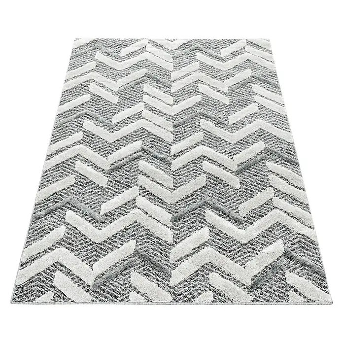 Hochflorteppich Pisa 4705Grau, 250 x 80 cm, 100% Polypropylen - Ein rechteckiger Teppich mit einem Zickzackmuster in Grau- und Weißtönen, der eine moderne und stilvolle Ergänzung für jeden Raum darstellt.