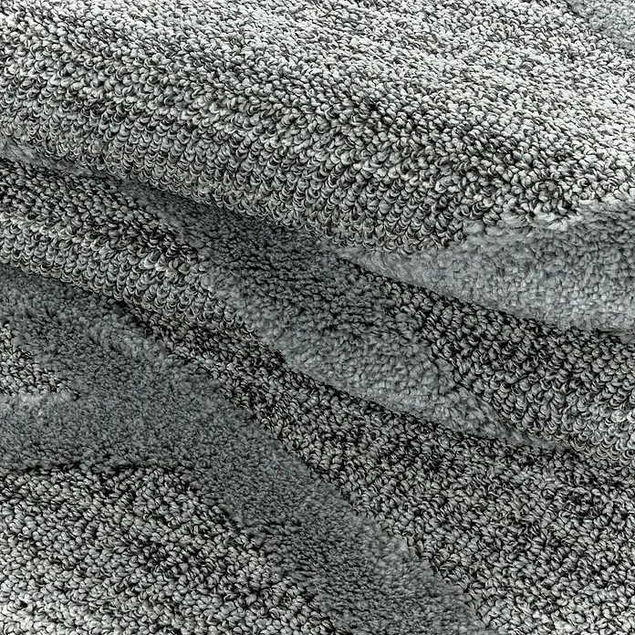 Hochflorteppich Pisa 4706 - Grau, 200 x 140 cm, 100% Polypropylen - Nahaufnahme eines grauen Teppichs mit weicher Textur, ideal für gemütliche Wohnräume und zur Dekoration.