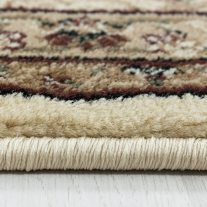 Kurzflorteppich Kashmir 2602Beige, 150 x 80 cm, 100% Polypropylen - Detailaufnahme eines beigefarbenen Teppichs mit floralem Muster, der die hochwertige Verarbeitung und das elegante Design hervorhebt.
