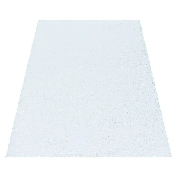 Hochflorteppich Sydney 3000Weiß, 170 x 120 cm, 100% Polypropylen - Ein weißer Teppich mit unregelmäßiger Textur auf schwarzem Hintergrund. Ideal für Wohnräume, die eine minimalistische und saubere Ästhetik suchen.