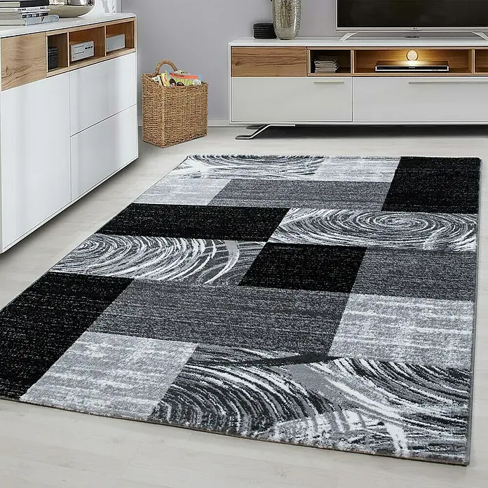 Kurzflorteppich Parma 9220Schwarz, 150 x 80 cm, 100% Polypropylen - Ein moderner Teppich in Schwarz-, Grau- und Weißtönen mit einem abstrakten Muster, das jedem Raum einen Hauch von Stil verleiht.